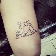 a dog and cat tattoo on the leg