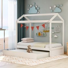 a child's bedroom with a white bed frame and canopy over the bed in front of a window