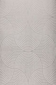 an area rug with circles in grey and white