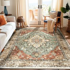 a living room filled with furniture and a large rug