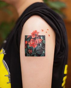 a person with a flower tattoo on their arm