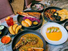 a table topped with lots of different types of food