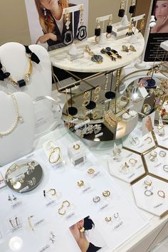 a table topped with lots of jewelry on display