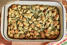 a casserole dish filled with stuffing and vegetables