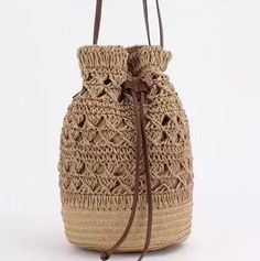 a straw bag is shown on a white background