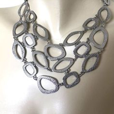 This Chic And Stylish Bcbgmaxazria Silver Tone Statement Necklace Looks Great For Almost Any Occasion. It Looks Great Tucked Under A Classic Shirt And Blazer. Or, Wear It Over A Blouse Or Turtleneck For More Dressy Occasions. It Features Irregularly Shaped Links That Graduate From 1" In Back To 3.5 Inches In Front. The Total Length Ranges From 16" To 18" With The Extender. New With Tags, The Original Retail Price Was $78.00. Metal Chain Bib Necklaces, Metal Bib Necklace With Chain, Metal Bib Necklaces With Chain, Chic Silver Bib Necklace For Party, Leather Collar Necklace, Bracelet Set Silver, Gold Bracelet Set, Crystal Statement Necklace, Choker Style Necklace