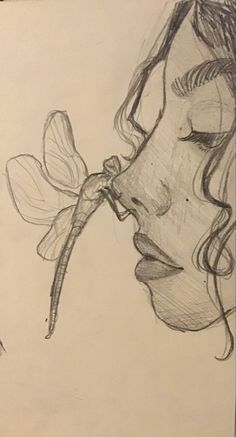 a pencil drawing of a woman's face with flowers in her hair and eyes closed