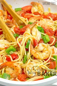 shrimp and tomato pasta in a white bowl with chopsticks on the side that says shrimp poss