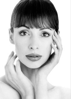 a black and white photo of a woman with short hair