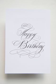 a card with the words happy birthday written in cursive writing on it's front