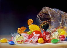 a pile of gummy bears sitting on top of a table next to a plastic bag