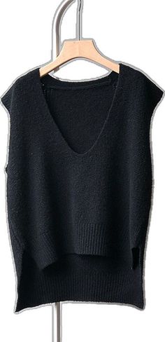 Black V-neck Tank Top For Layering, Black Stretch V-neck Sweater Vest, Versatile Black V-neck Tank Top, Black Knitted Sleeveless Sweater Vest, Black Sleeveless Knitted Top, Black Sleeveless Winter Knit Top, Black Sleeveless Knit Top For Winter, Sleeveless Black Knit Top For Winter, Chic Black Knit Vest