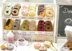 an assortment of doughnuts and pastries on display