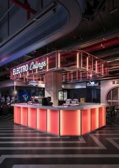 the interior of an electronic lounge with neon lights