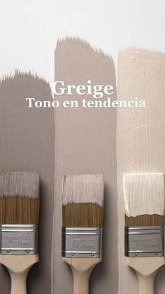 three paintbrushes with different shades of gray and white on them, one has the words greige tono en tendencia