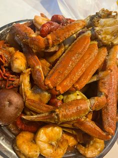 a plate full of cooked crabs and other seafood