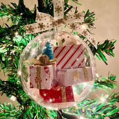 a christmas ornament with presents in it