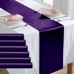 purple and white table runner with place settings