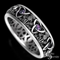 "See this ring with more stones/metal choices: www.etsy.com/shop/CelticEternity?search_query=1813 Band Height: 6.1mm Stones: 8x2mm Alexandrite This ring balances the classic thistle and trinity knot, circling the band in an unbroken pattern. The thistle represents overcoming adversity and difficult situations. It's a symbol of resilience. The thistle is renowned in Scotland where it is not only the country's national emblem but also the base of Scotland's ancient order of chivalry known as \"The Order of the Thistle.\" Given the legend surrounding the Scottish thistle, the plant clearly connotes bravery, courage, and loyalty in the face of treachery. In Celtic regions, the thistle represents devotion, bravery, determination, and strength. Every ring is made to order and in YOUR CUSTOM size Scottish Thistle Ring, Medieval Engraved Jewelry For Weddings, Medieval Engraved Wedding Jewelry, Medieval Style Engraved Wedding Jewelry, Symbolic Gemstone Wedding Rings, Symbolic Gemstone Rings For Wedding, Symbolic Wedding Gemstone Rings, Medieval Style Wedding Ring Jewelry, Medieval Style Wedding Jewelry