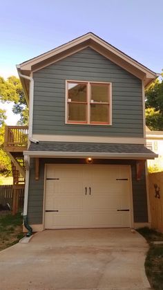 a two story house with an attached garage