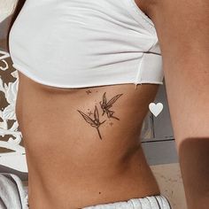 a woman with a tattoo on her stomach