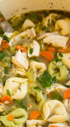 a white bowl filled with chicken noodle soup