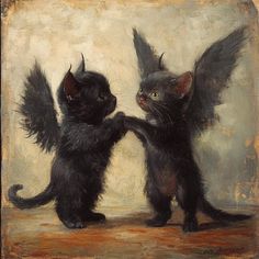 two black kittens are playing with each other