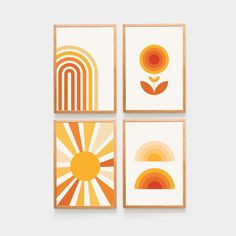 four framed art pieces with different shapes and colors on them, each featuring an orange flower