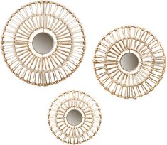 three round mirrors are shown in the shape of sunbursts, and one is made out of rattan