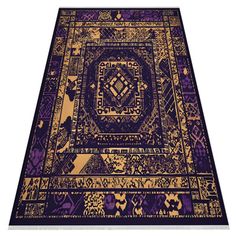 a purple and gold rug with an intricate design on the bottom, in front of a white background