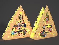 two wooden christmas trees with cartoon characters on them