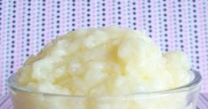 a bowl filled with food sitting on top of a pink and white checkered table cloth