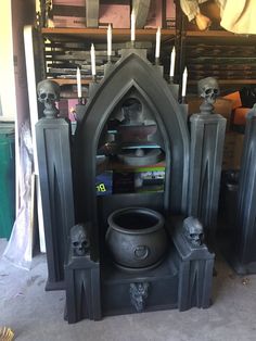 an altar with skulls and candles in it