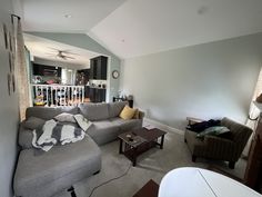 a living room filled with furniture and a flat screen tv