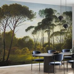 a dining room with a large mural on the wall