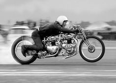 a man riding on the back of a motorcycle