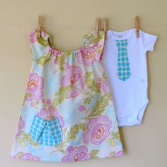 This is about the only way I could manage coordinating brother/sister outfits.  I could do a tie on a big-boy t-shirt.  And I like the pocket on the peasant dress. Twin Clothes, Twins Girl, Unique Bodysuit, Girls Ruffle Pants, Girls Peasant Dress, Cute Twins, Large Scale Floral, Twin Outfits