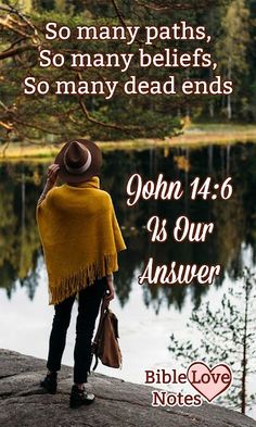 a person standing on top of a rock next to a lake with a bible verse