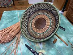 a table topped with lots of different types of crafting supplies and scissors on top of it