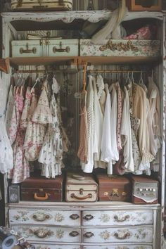 an old dresser with clothes and suitcases on it's shelves in a closet