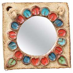 a mirror that is made out of clay