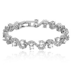 PRICES MAY VARY. REJOICE A SPECIAL LADY WITH A STUNNING TENNIS BRACELET: If you are looking for a thoughtful and beautiful women's tennis bracelet for your loved ones, look no further than the Crystalline Azuria tennis bracelet. DAZZLE EVERYONE WITH YOUR GRACEFUL WOMEN'S BRACELET: Decorated with green, blue, and white simulated emerald, sapphire, and cubic zirconia crystals, this chic bracelet will make all heads turn. TAKE YOUR OUTFITS TO THE NEXT LEVEL WITH YOUR BRACELET: Perfect for formal, b Sparkle Bracelet, Chic Bracelet, 18th Birthday Gifts, Premium Gift, Gold Plated Bracelets, Rhinestone Bracelet, Tennis Bracelet, Crystal Bracelets, Womens Jewelry Bracelets