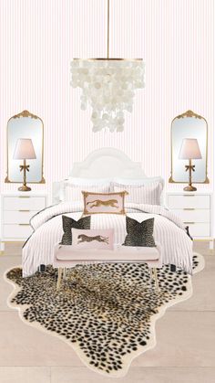 a white bed sitting next to two lamps on top of a wooden floor covered in animal print