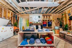 a room filled with lots of surfboards and other items