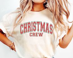 a woman wearing a christmas crew t - shirt with the word'christmas crew'on it