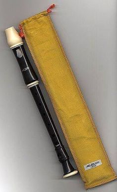 a black and white pen in a yellow case