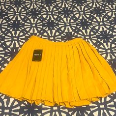 Forever 21 Yellow Mini Skirt. Never Worn! Yellow Stretch Pleated Skirt, Yellow Pleated Stretch Skirt, Yellow Pleated Skirt For Party, Yellow Pleated Party Bottoms, Trendy Yellow Mini Skirt For Party, Casual Yellow Mini Skirt For Party, Yellow Stretch Mini Skirt, Stretch Yellow Mini Skirt, Yellow Stretch Flared Skirt