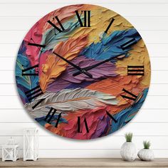 a clock with feathers painted on it