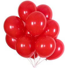 a bunch of red balloons floating in the air