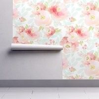 the wall paper has pink flowers on it